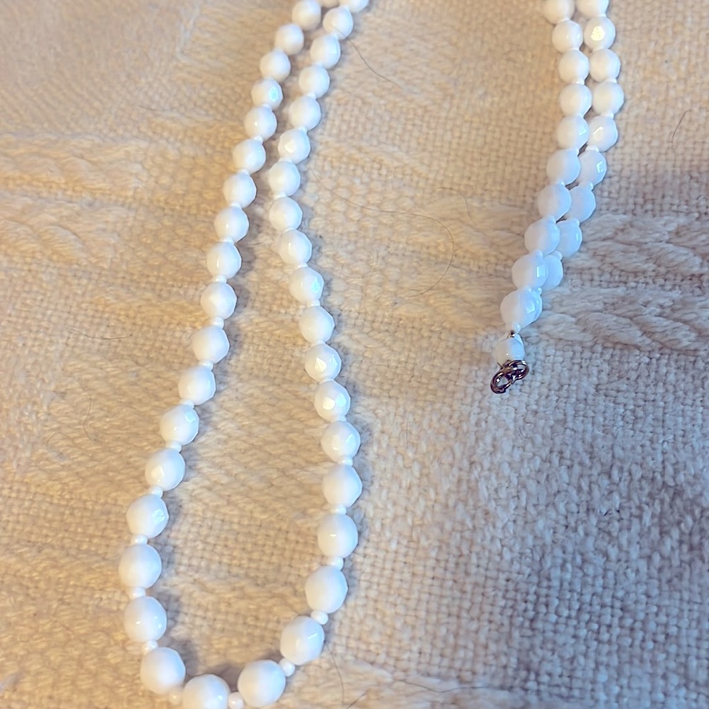 Vintage glass like beads.  White color cool to the touch, 14 inches long